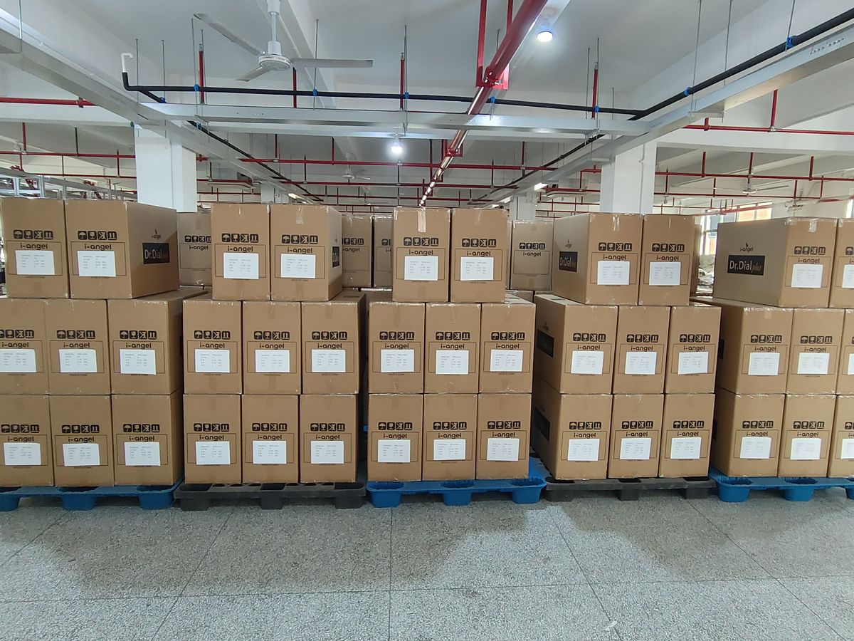 Rows of palletised cartons along a warehouse aisle.