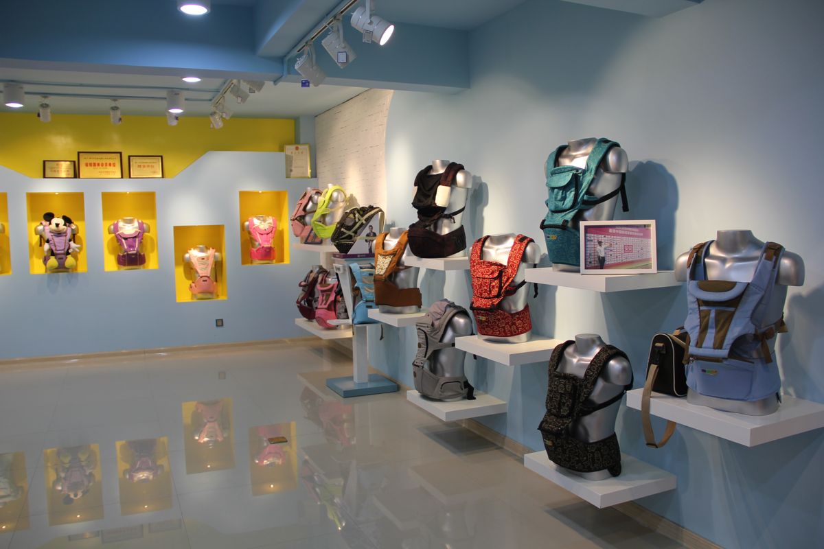 The partner's showroom, carriers displayed on wall-mounted stands.
